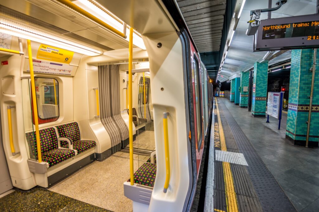 An empty train and platform of an Underground station