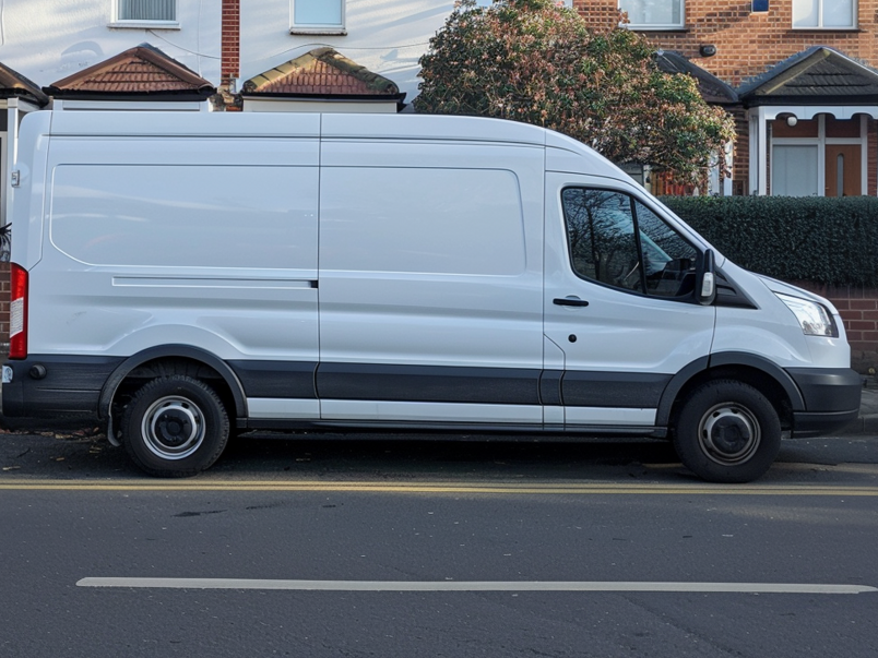 A white relocation van parked at the street of Coulsdon